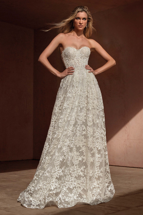 Embrace effortless romance in this strapless A-line gown with floral lace embroidery and a sweetheart neckline Embrace effortless romance in this strapless A-line gown with floral lace embroidery and a sweetheart neckline