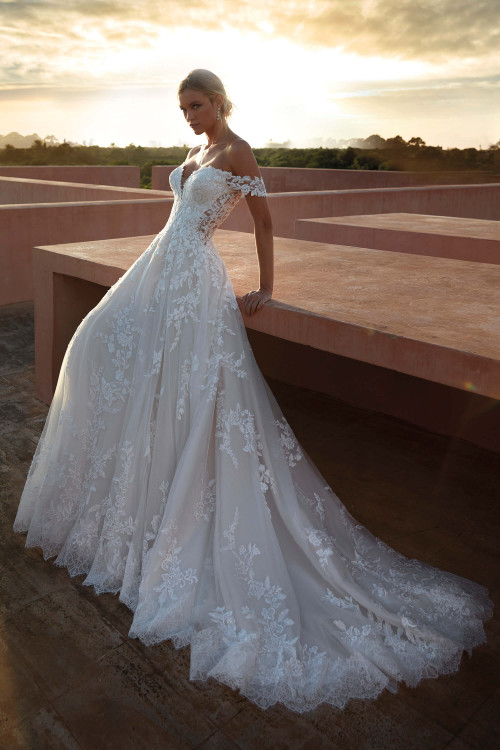 Romantic off-the-shoulder lace gown with illusion corset bodice and a scalloped chapel train Romantic off-the-shoulder lace gown with illusion corset bodice and a scalloped chapel train