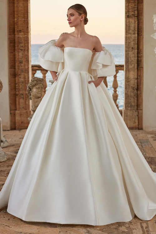 Dramatic strapless ball gown with sculpted bodice and oversized layered puff sleeves with cape Dramatic strapless ball gown with sculpted bodice and oversized layered puff sleeves with cape