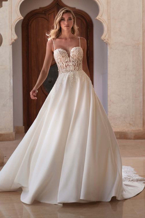 Illusion lace bodice and spaghetti-strap ballgown with sleek mikado skirt and sweeping chapel train Illusion lace bodice and spaghetti-strap ballgown with sleek mikado skirt and sweeping chapel train