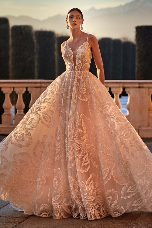 Ball gown features a deep plunge neckline and intricate floral lace overlay Ball gown features a deep plunge neckline and intricate floral lace overlay