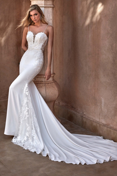 Illusion lace bodice with delicate straps flows into a sleek, elegant crepe skirt with lace train Illusion lace bodice with delicate straps flows into a sleek, elegant crepe skirt with lace train