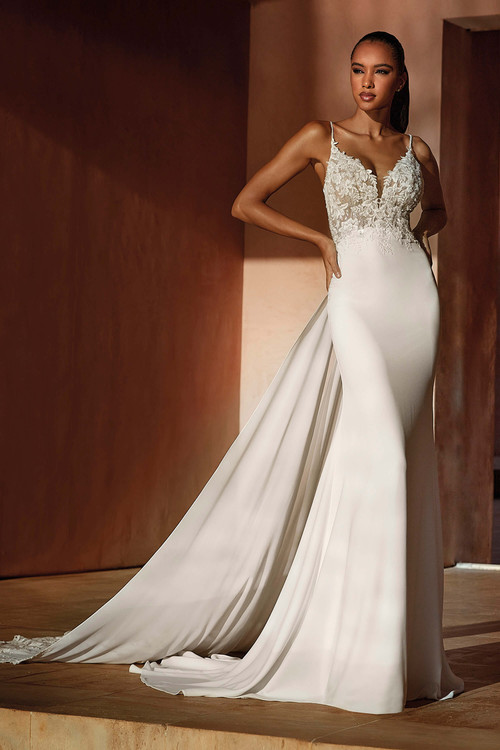 Spaghetti strap fit-and-flare gown with floral lace bodice and dramatic detachable flowing train Spaghetti strap fit-and-flare gown with floral lace bodice and dramatic detachable flowing train