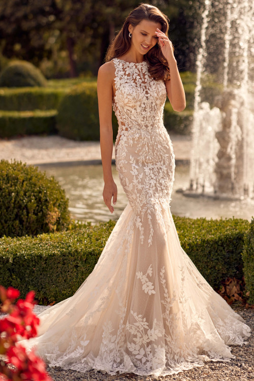 Illusion high neckline gown with bold floral lace, curve-hugging fit, and romantic train Illusion high neckline gown with bold floral lace, curve-hugging fit, and romantic train