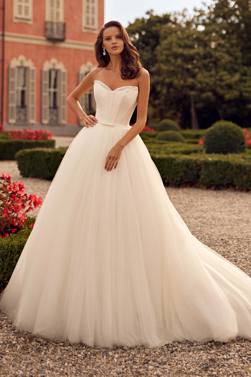 Strapless tulle ballgown with structured bodice and delicate beaded neckline Strapless tulle ballgown with structured bodice and delicate beaded neckline