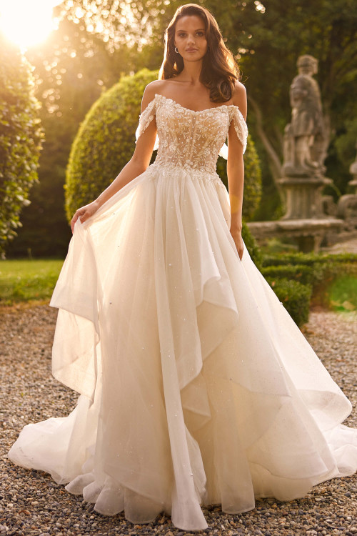 Ethereal off-shoulder ballgown with beaded corset bodice and layered tulle skirt. Ethereal off-shoulder ballgown with beaded corset bodice and layered tulle skirt.