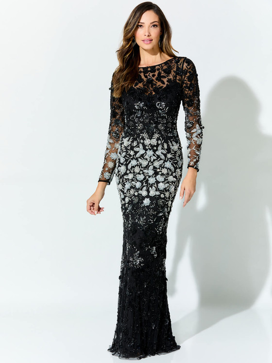 Silver florals bloom across sheer black mesh in this long sleeve gown with radiant sparkle Silver florals bloom across sheer black mesh in this long sleeve gown with radiant sparkle