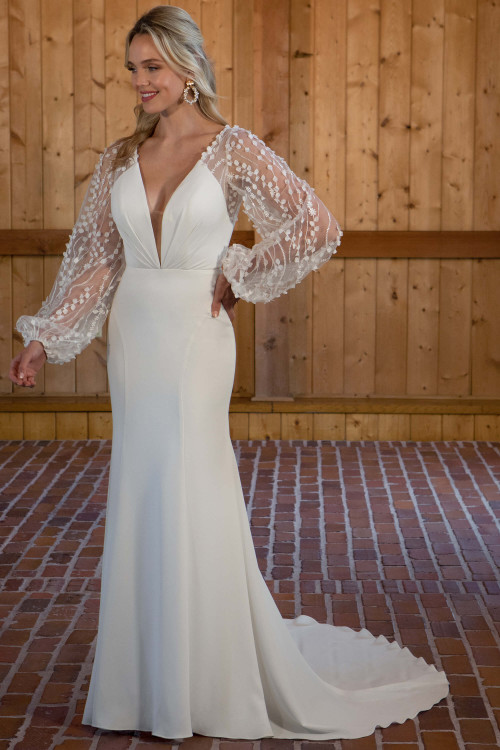 Chic meets whimsy in this deep V gown, featuring airy dotted bishop sleeves and a sleek crepe skirt Chic meets whimsy in this deep V gown, featuring airy dotted bishop sleeves and a sleek crepe skirt