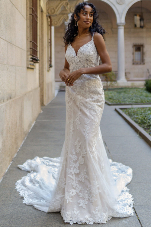 Romantic floral lace cascades over a sculpted silhouette with an ethereal, chapel-length train Romantic floral lace cascades over a sculpted silhouette with an ethereal, chapel-length train