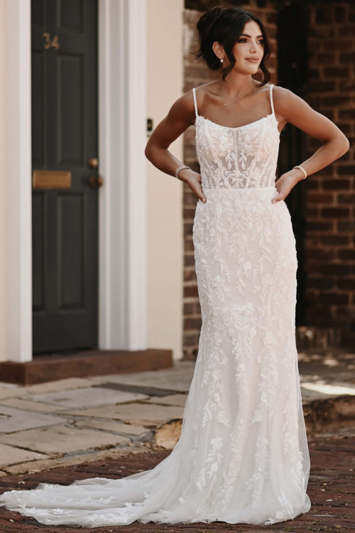 Delicate floral lace cascades over this sheer corset gown with effortless charm Delicate floral lace cascades over this sheer corset gown with effortless charm