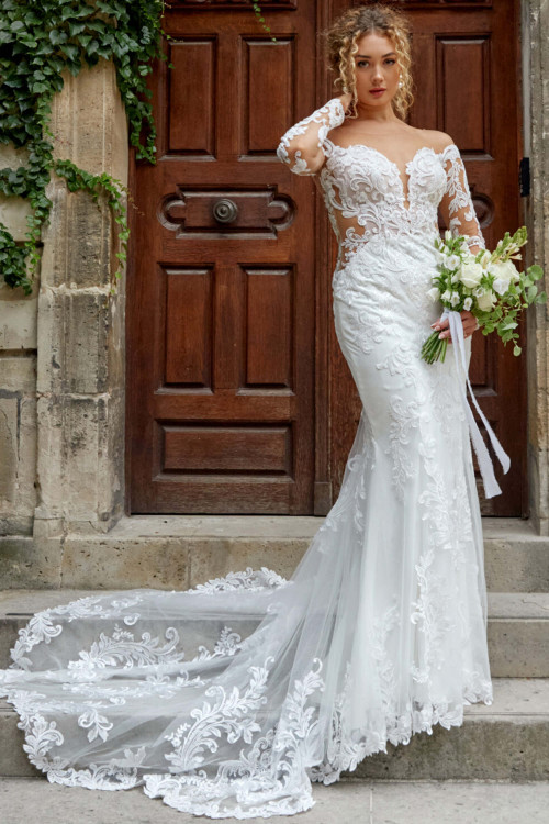 Romance reigns in this lace illusion gown with a dramatic, scalloped cathedral train Romance reigns in this lace illusion gown with a dramatic, scalloped cathedral train