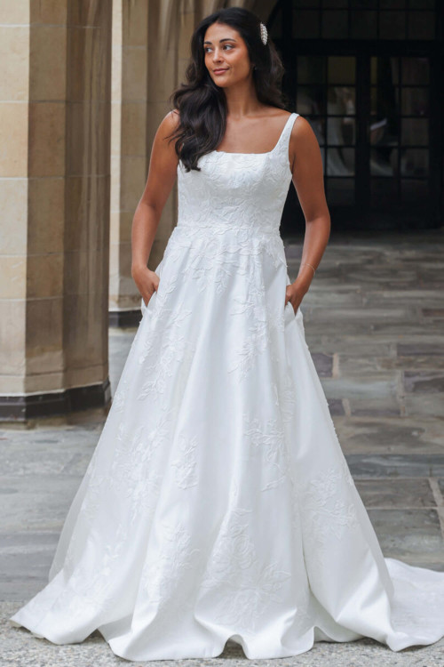 Effortlessly elegant, this floral jacquard gown stuns with pockets and a modern square neckline Effortlessly elegant, this floral jacquard gown stuns with pockets and a modern square neckline