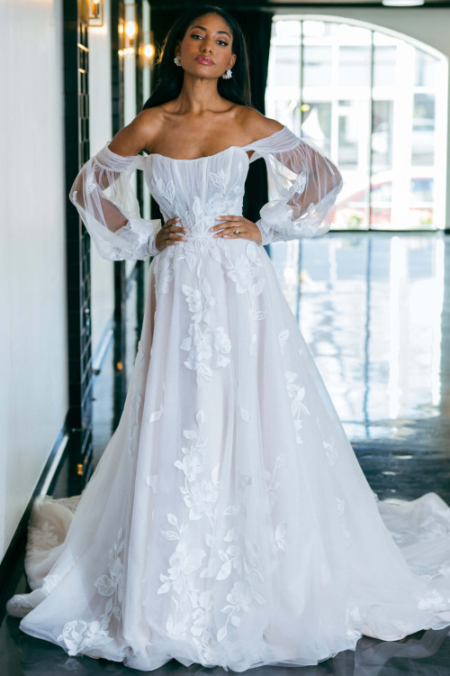 Ethereal floral lace floats over sheer bishop sleeves and a dreamy A-line skirt Ethereal floral lace floats over sheer bishop sleeves and a dreamy A-line skirt