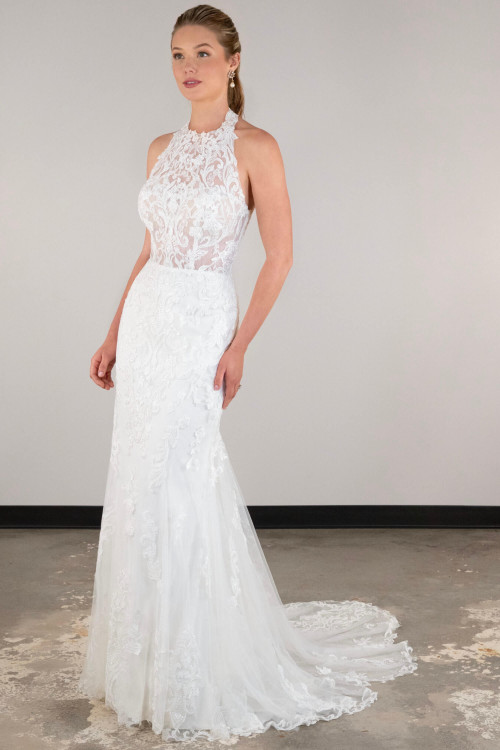 Sheer lace halter bodice meets a fitted skirt with ornate embroidery and soft train Sheer lace halter bodice meets a fitted skirt with ornate embroidery and soft train