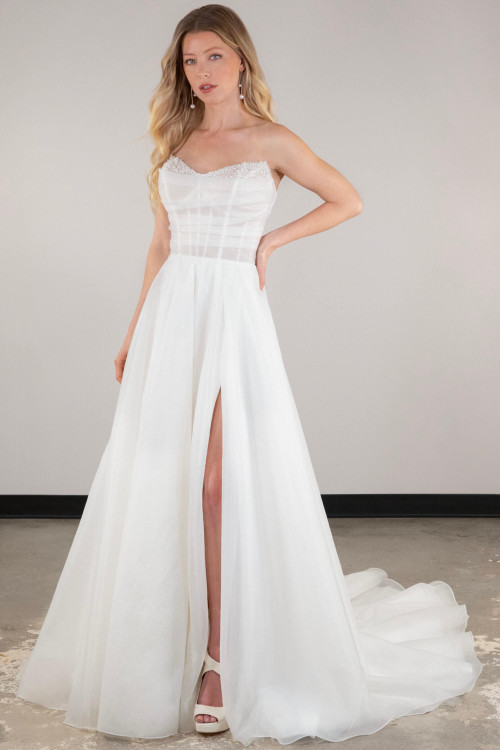 Organza A-line gown with beaded bodice and a daring thigh-high slit Organza A-line gown with beaded bodice and a daring thigh-high slit