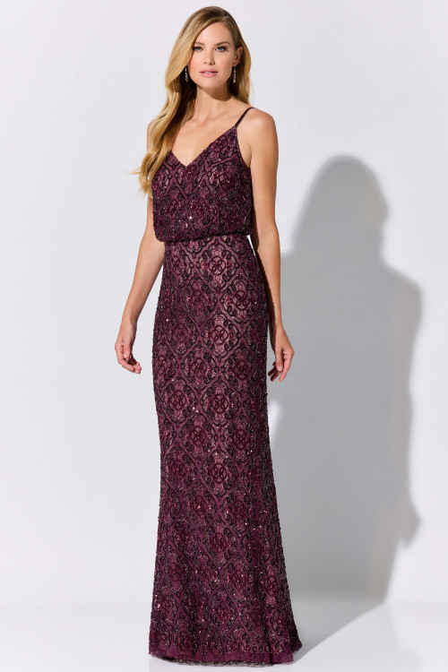 Ornate beading elevates this lace gown with a draped waist and slim silhouette