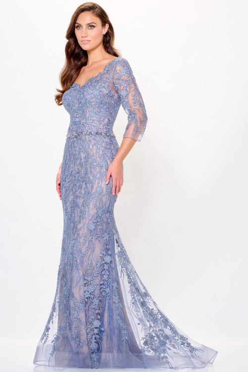 Dusty blue gown with floral embroidery, illusion sleeves, and sheer tulle train Dusty blue gown with floral embroidery, illusion sleeves, and sheer tulle train