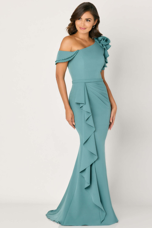 Dusty teal gown with ruffled shoulder rosette, off-shoulder straps, and cascading drape Dusty teal gown with ruffled shoulder rosette, off-shoulder straps, and cascading drape
