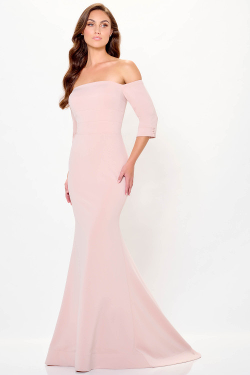 Blush off-shoulder gown with three-quarter sleeves and sculpted mermaid silhouette Blush off-shoulder gown with three-quarter sleeves and sculpted mermaid silhouette