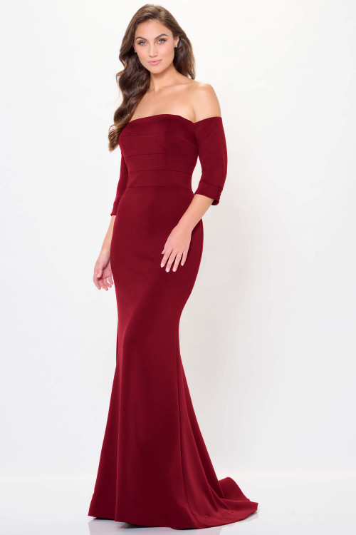 Burgundy off-shoulder gown with paneled bodice and soft trumpet flare