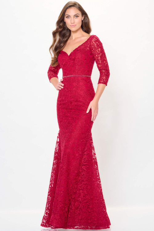 Embroidered red gown with illusion neckline and sleeves, plus subtle sparkle at the waist Embroidered red gown with illusion neckline and sleeves, plus subtle sparkle at the waist