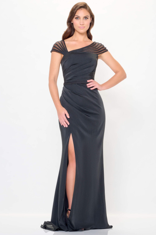 Asymmetric pleated bodice and sheer cap sleeves shape this sleek gown