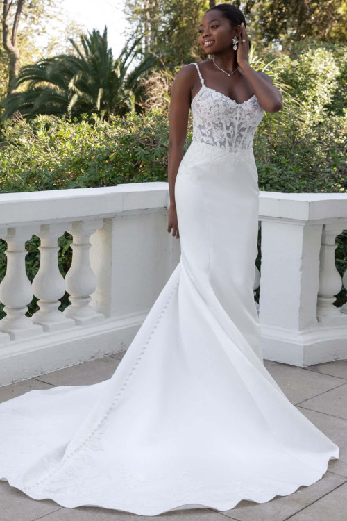 Sheer lace bodice meets sleek fitted satin skirt with long chapel train Sheer lace bodice meets sleek fitted satin skirt with long chapel train