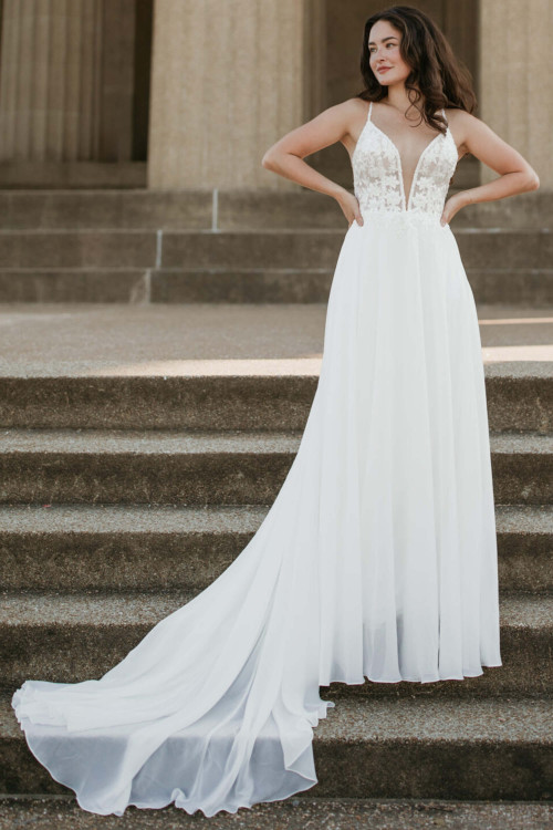 Plunging lace bodice meets airy chiffon skirt with soft flowing train Plunging lace bodice meets airy chiffon skirt with soft flowing train