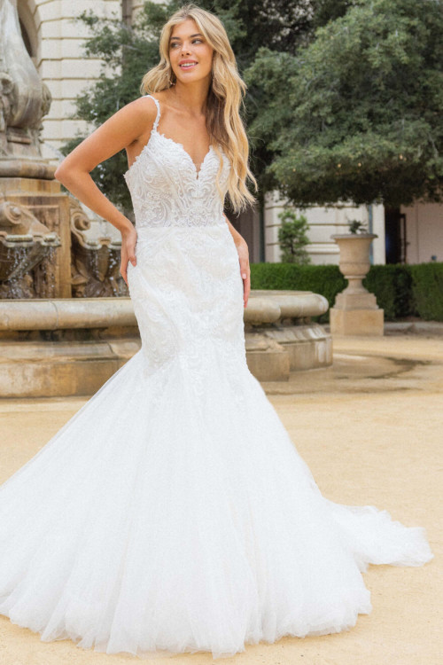 Intricate lace bodice melts into a soft tulle mermaid flare Intricate lace bodice melts into a soft tulle mermaid flare