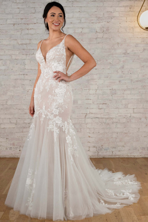 Floral lace cascades into airy tulle with sculpted romance Floral lace cascades into airy tulle with sculpted romance