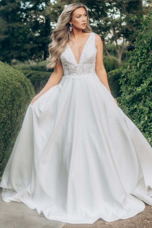 Plunging V-neck bodice meets a sleek mikado skirt for fairytale allure Plunging V-neck bodice meets a sleek mikado skirt for fairytale allure
