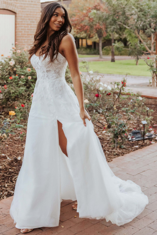 Whimsical lace top meets flowy A-line skirt with thigh-high slit Whimsical lace top meets flowy A-line skirt with thigh-high slit