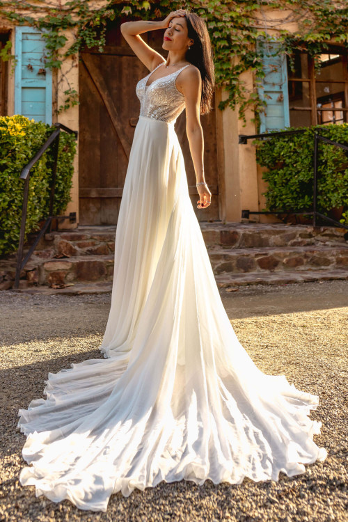 Flowing chiffon skirt pairs with a sequin-embellished bodice Flowing chiffon skirt pairs with a sequin-embellished bodice