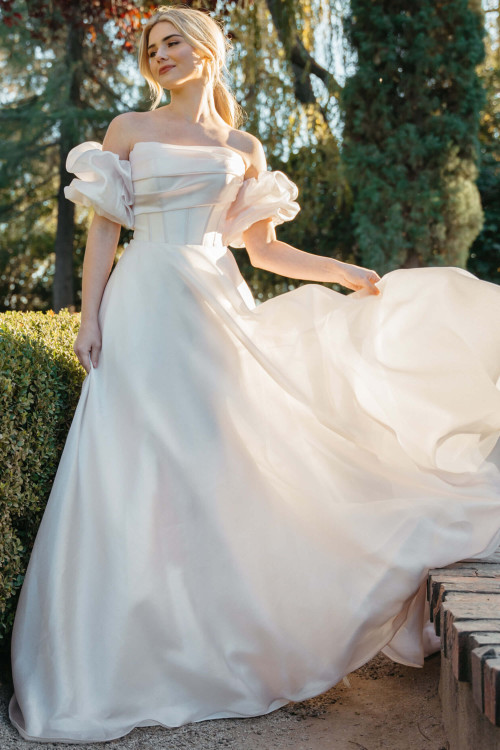 Romantic A-line gown with organza puff sleeves and a ruched corset bodice Romantic A-line gown with organza puff sleeves and a ruched corset bodice
