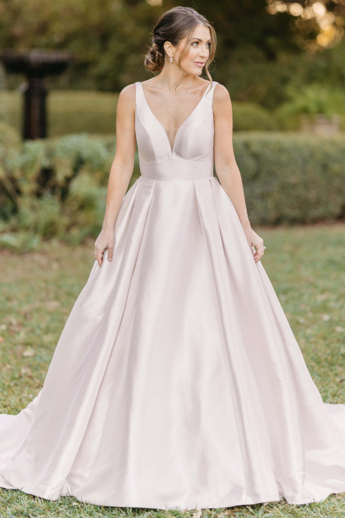 Luxe mikado ball gown with deep V-neckline and soft pleated skirt Luxe mikado ball gown with deep V-neckline and soft pleated skirt