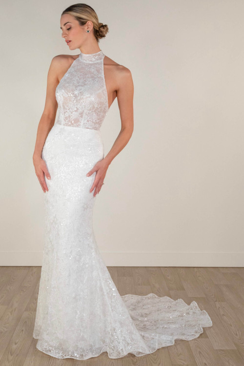 A curve-hugging lace gown with high halter neckline and illusion bodice sparkle A curve-hugging lace gown with high halter neckline and illusion bodice sparkle