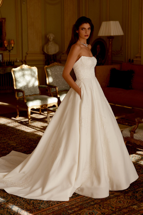 Timeless A-line silhouette with intricate embroidery. Timeless A-line silhouette with intricate embroidery.