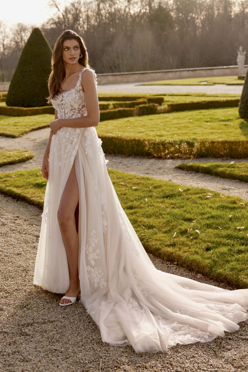 Soft A-line silhouette with 3D floral appliques Soft A-line silhouette with 3D floral appliques