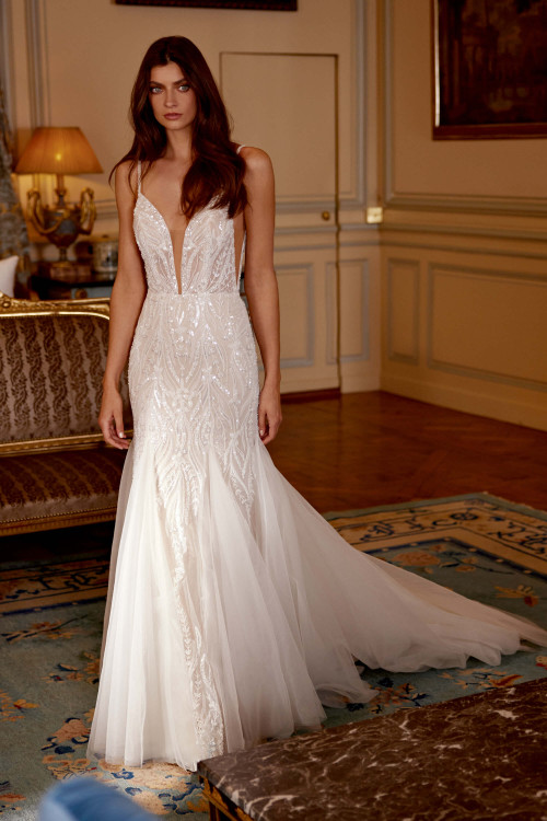 Glamorous beaded detailing on a fit-and-flare silhouette Glamorous beaded detailing on a fit-and-flare silhouette