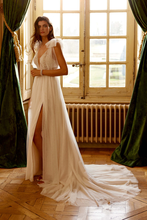 Glamourous boho A-line bridal gown with a skirt slit Glamourous boho A-line bridal gown with a skirt slit