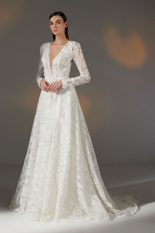 Romantic long-sleeve lace gown with a plunging neckline and full A-line skirt Romantic long-sleeve lace gown with a plunging neckline and full A-line skirt