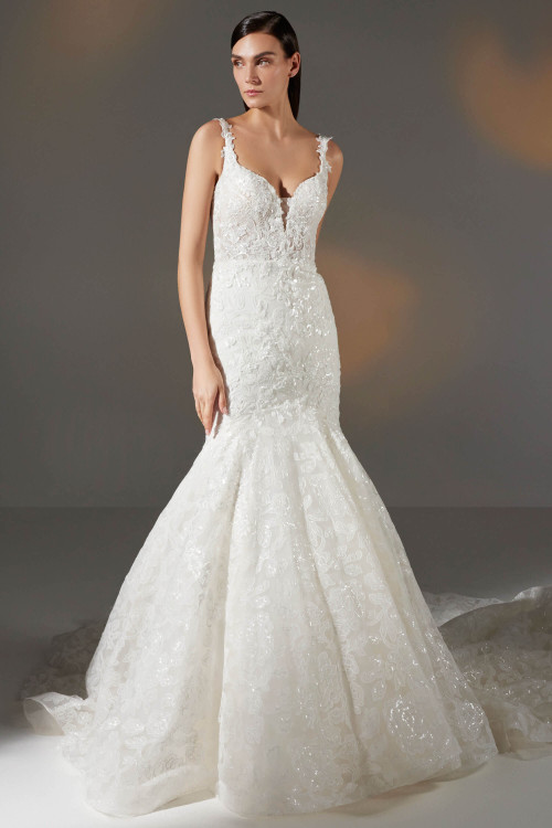This mermaid gown stuns with a plunging neckline, floral lace straps, and shimmering embroidery This mermaid gown stuns with a plunging neckline, floral lace straps, and shimmering embroidery