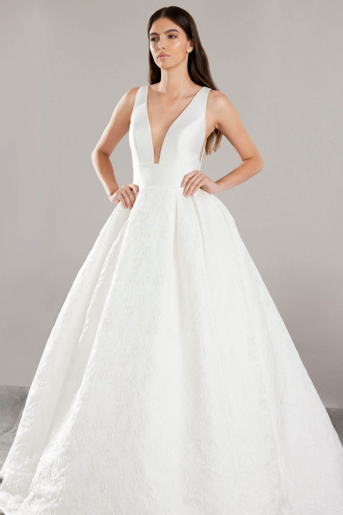 Plunging V-neck ball gown with wide straps and a textured floral jacquard skirt Plunging V-neck ball gown with wide straps and a textured floral jacquard skirt