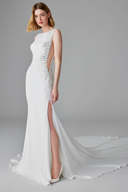 Modern sheath gown with daring side cutout, crystal sunburst beading, and thigh-high slit Modern sheath gown with daring side cutout, crystal sunburst beading, and thigh-high slit