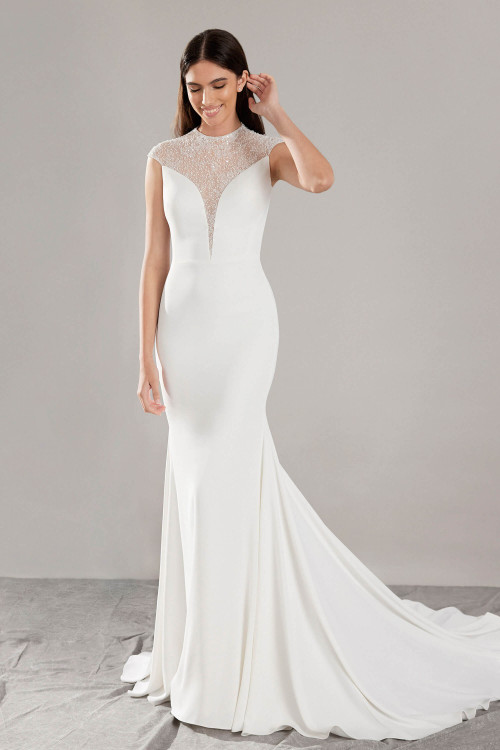 Sleek crepe gown with illusion beaded neckline and plunging detail for modern minimalist elegance Sleek crepe gown with illusion beaded neckline and plunging detail for modern minimalist elegance