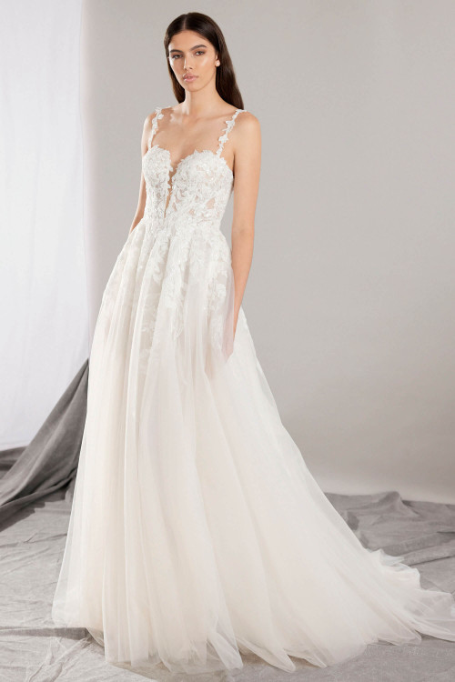Romantic A-line gown with lace appliqués, sheer bodice, and plunging neckline with floral applique straps Romantic A-line gown with lace appliqués, sheer bodice, and plunging neckline with floral applique straps