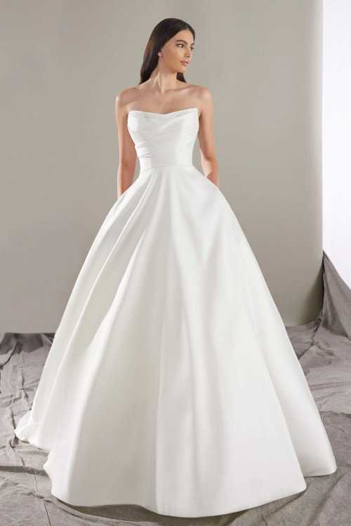 A timeless ballgown with a sculpted strapless bodice and clean, voluminous mikado skirt A timeless ballgown with a sculpted strapless bodice and clean, voluminous mikado skirt