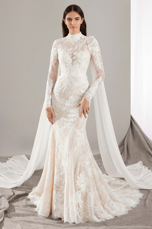 Vintage romance meets regal drama in this high-neck lace gown with flowing chiffon shoulder streamers Vintage romance meets regal drama in this high-neck lace gown with flowing chiffon shoulder streamers