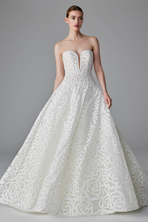 Bold floral appliqué and a sculpted strapless neckline create a show stopping, ultra-modern bridal ballgown Bold floral appliqué and a sculpted strapless neckline create a show stopping, ultra-modern bridal ballgown
