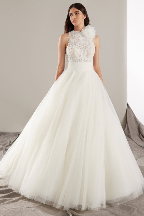 Ballgown with a high-neck lace bodice and voluminous tulle skirt create fairytale charm with couture elegance Ballgown with a high-neck lace bodice and voluminous tulle skirt create fairytale charm with couture elegance